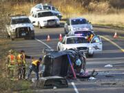 Crews respond to a collision on Instate 205 in Vancouver on Wednesday. Craig Johnson died after his vehicle collided with this truck.