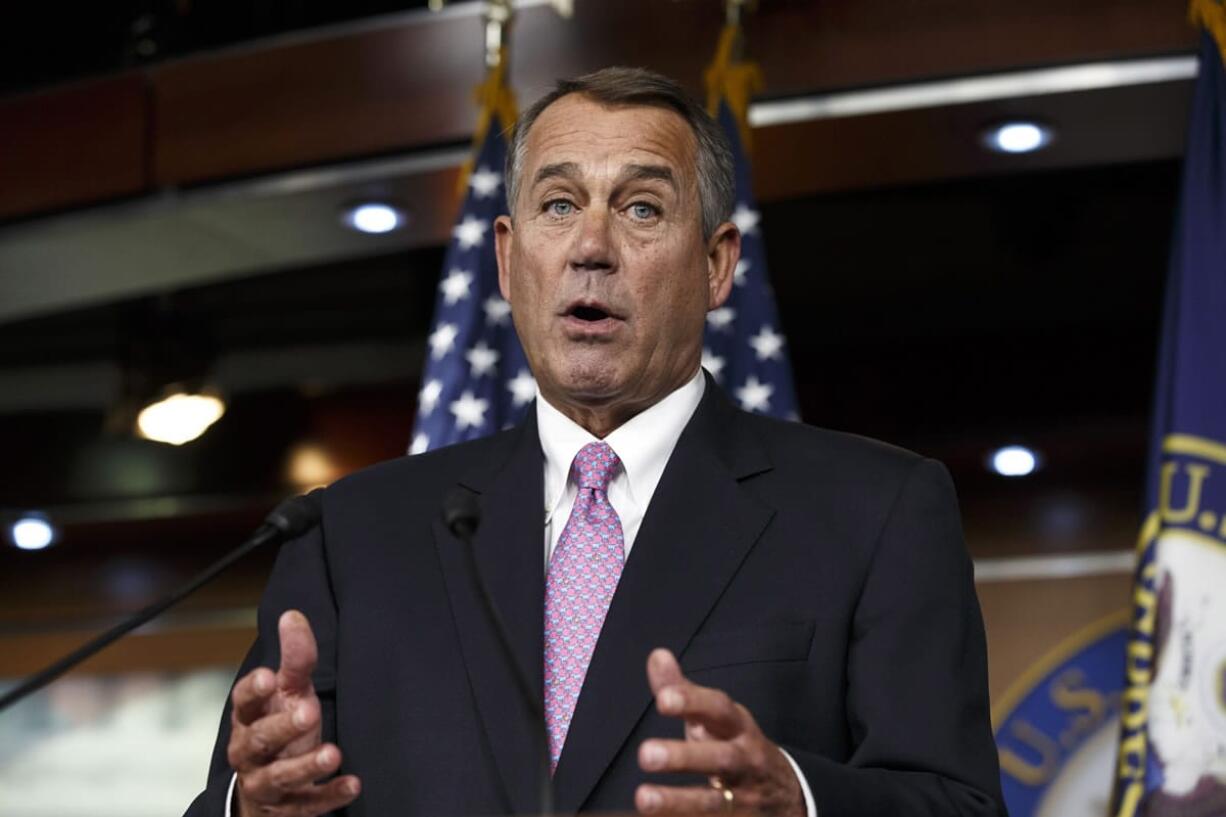 House Speaker John Boehner of Ohio speaks during a news conference Feb. 6 on Capitol Hill in Washington. In a concession to President Barack Obama and Democratic lawmakers, Boehner said Tuesday the House will vote to increase the government's borrowing cap without trying to attach conditions sought by some Republicans.