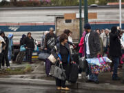 Passengers from Amtrak's Empire Builder line coming from Chicago and points east of Seattle wait at the train station in Mukilteo for buses to take them to Seattle, Edmonds and Redmond.