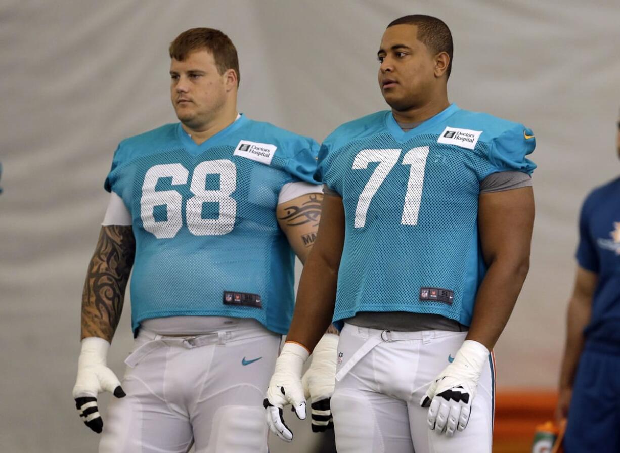 Miami Dolphins guard Richie Incognito, left, and tackle Jonathan Martin.