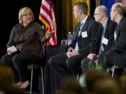 The Columbian's 2014 Economic Forecast Breakfast keynote panel included, from left, Betsy Henning, moderator; Rick Goode, CEO of Columbia Machine Inc.;  Jon Roberts, principal of TIP Strategies, based in Austin, Tex.; and Scott Bailey, regional economist for the state Employment Security Department.