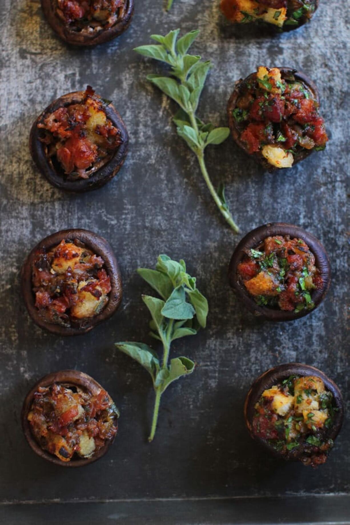 Italian style stuffed mushrooms, left, and Spanish style stuffed mushrooms (AP Photo/Matthew Mead)