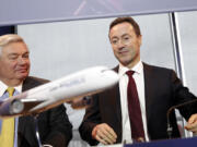 John Leahy, commercial director for Airbus, left, and Airbus CEO Fabrice Bregier arrive for an annual news conference in Toulouse, France, on Monday.