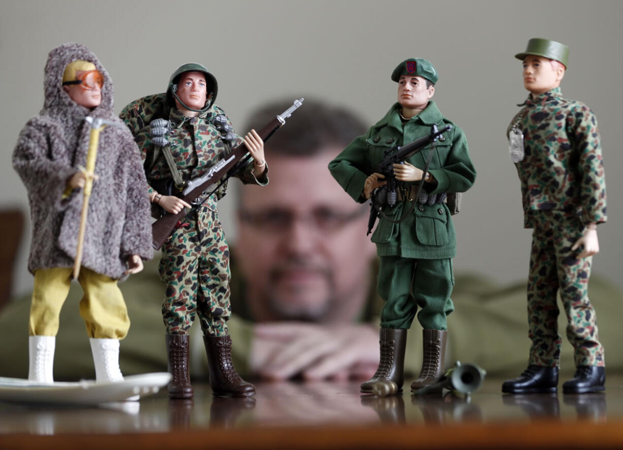 Tearle Ashby shows off some of his G.I. Joe action figures in Niskayuna, N.Y.