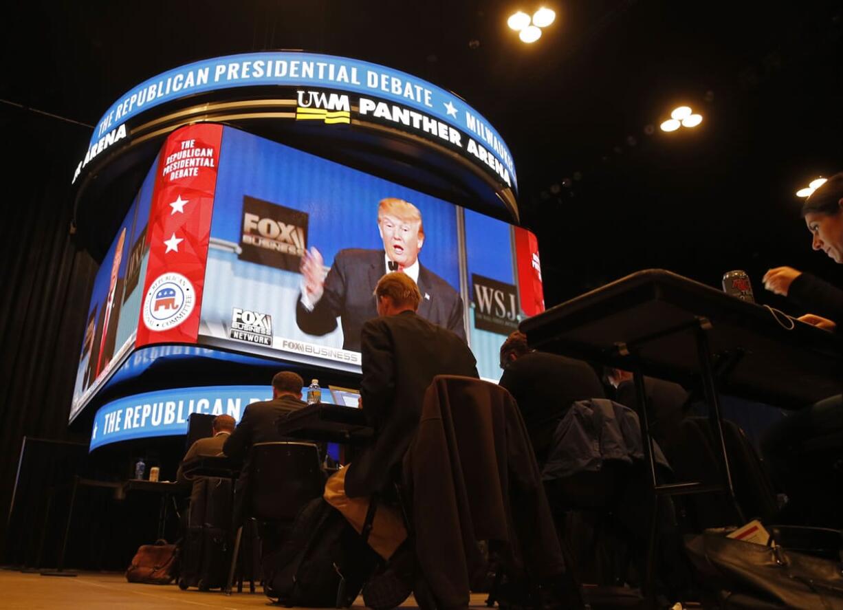 Donald Trump makes a point as journalists watch the Republican presidential debate in the media filing room at the Milwaukee Theatre on Tuesday in Milwaukee.