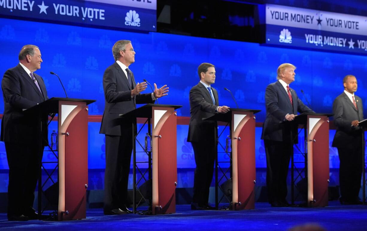 Jeb Bush, second from left, is flanked by Mike Huckabee, left, Marco Rubio, center, Donald Trump, second from right, and Ben Carson during the CNBC Republican presidential debate at the University of Colorado, Wednesday, Oct. 28, 2015, in Boulder, Colo. (AP Photo/Mark J.