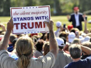 Republican presidential candidate Donald Trump speaks to supporters after arriving for a campaign rally Saturday, Nov. 28, 2015 at Robarts Arena in Sarasota, Fla.