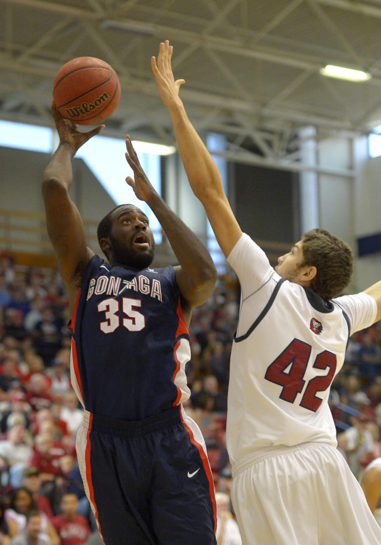 Gonzaga center Sam Dower, left, shoots as Loyola Marymount forward Marin Mornar defends during the first half Saturday at Los Angeles. (AP Photo/Mark J.