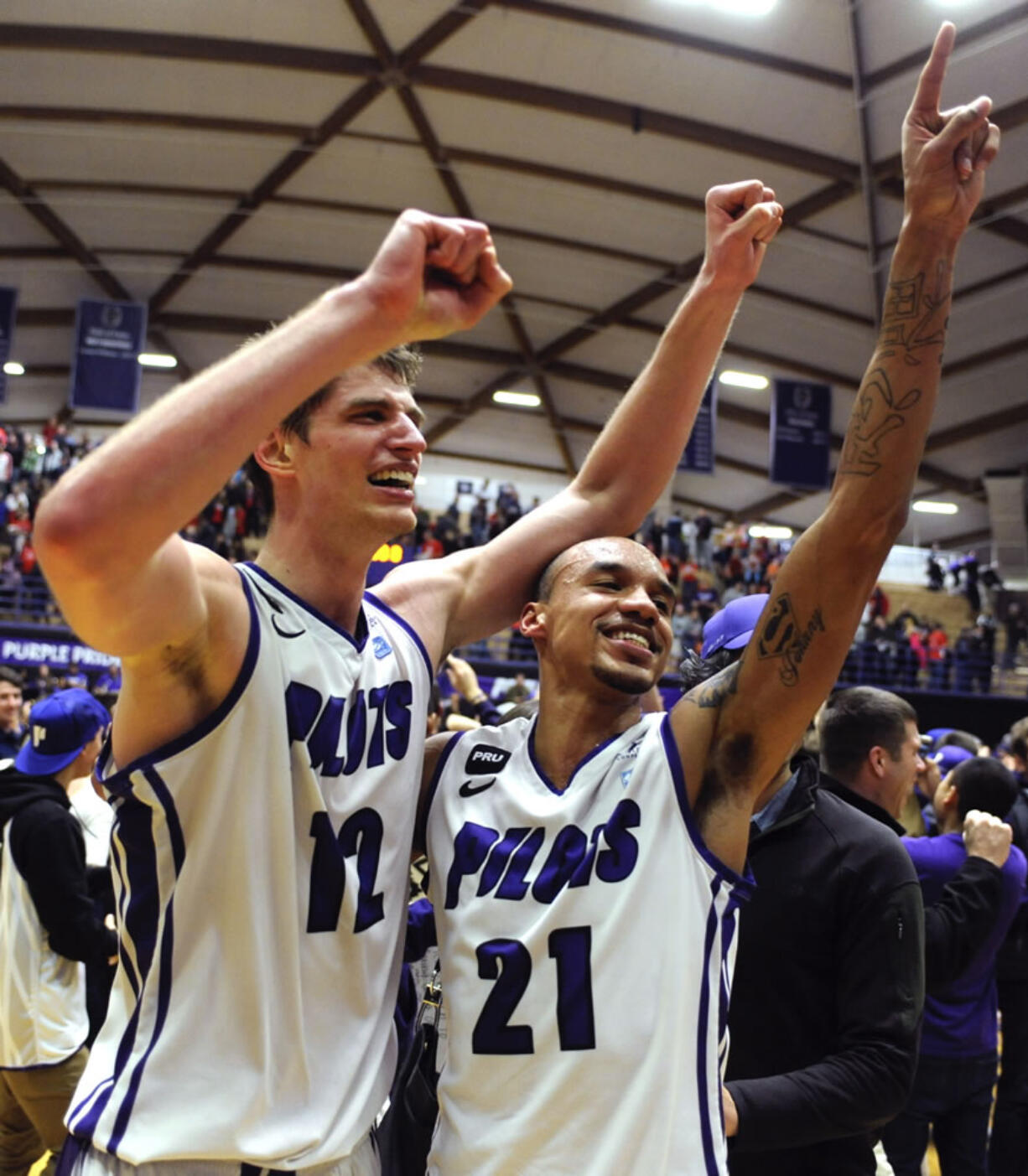 Thomas van der Mars (12) and Korey Thieleke (21) celebrate Portland's win over Gonzaga on Thursday.