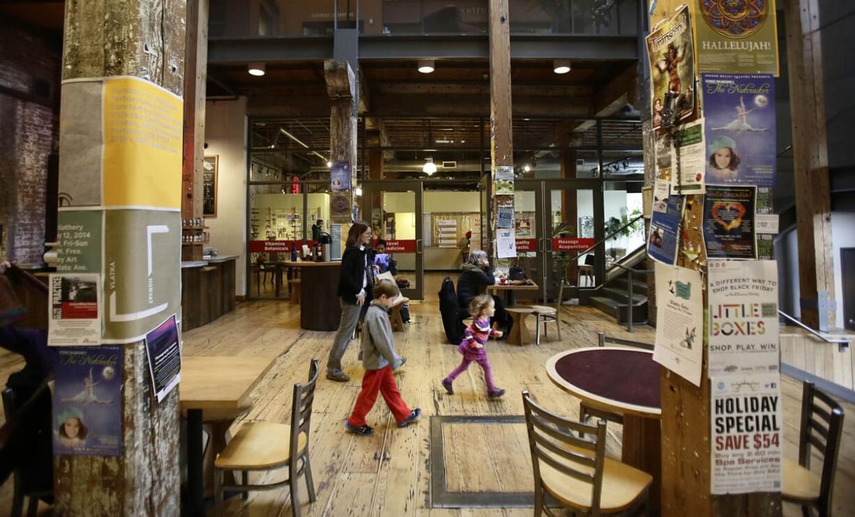 Photos by Don Ryan/Associated Press
Large, wooden beams grace the main area of the Ecotrust building, originally built in 1895 and restored in 2000, in Portland.  The building is a LEED-certified commercial building.