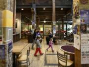 Photos by Don Ryan/Associated Press
Large, wooden beams grace the main area of the Ecotrust building, originally built in 1895 and restored in 2000, in Portland.  The building is a LEED-certified commercial building.