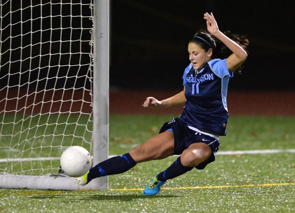 Hockinson's Sydnie Cole-Vogler makes a sliding kick save in the first half as Squalicum beat Hockinson 1-0 in the first round of the Class 2A State Girls' Soccer Playoffs at Civic Stadium in Bellingham on Tuesday.