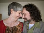 Hannibal Woodward and his wife Angela, of Vancouver share a moment after talking about his long road to recovery at his home on Tuesday.