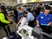 A Best Buy employee rings up a 32-inch LED TV in Dunwoody, Ga.