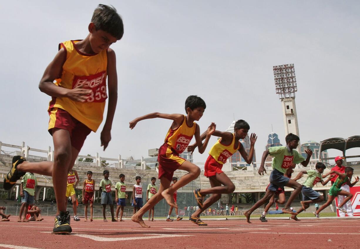 Boys participate in 100 meter race during two-day World Athletics Day meet in Bangalore, India.