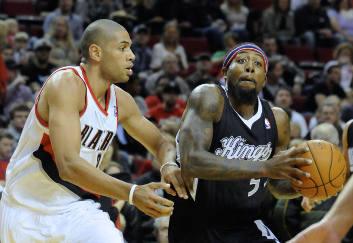 Portland's Nicolas Batum, left, defends against Sacramento's John Salmon on Friday at Moda Center.