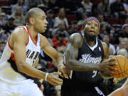 Portland's Nicolas Batum, left, defends against Sacramento's John Salmon on Friday at Moda Center.