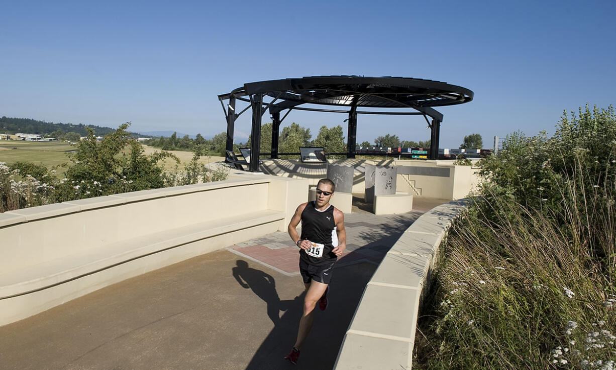 Joshua Monda of Vancouver is the first to cross the Vancouver Land Bridge in the summer solstice 6-mile run in 2009.