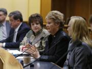 Rep. Judy Clibborn, D-Mercer Island, second from right, chair of the House Transportation Committee, talks about the upcoming legislative session on Thursday at the AP Legislative Preview in Olympia. Looking on are Secretary of Transportation Lynn Peterson, right, and Sen.