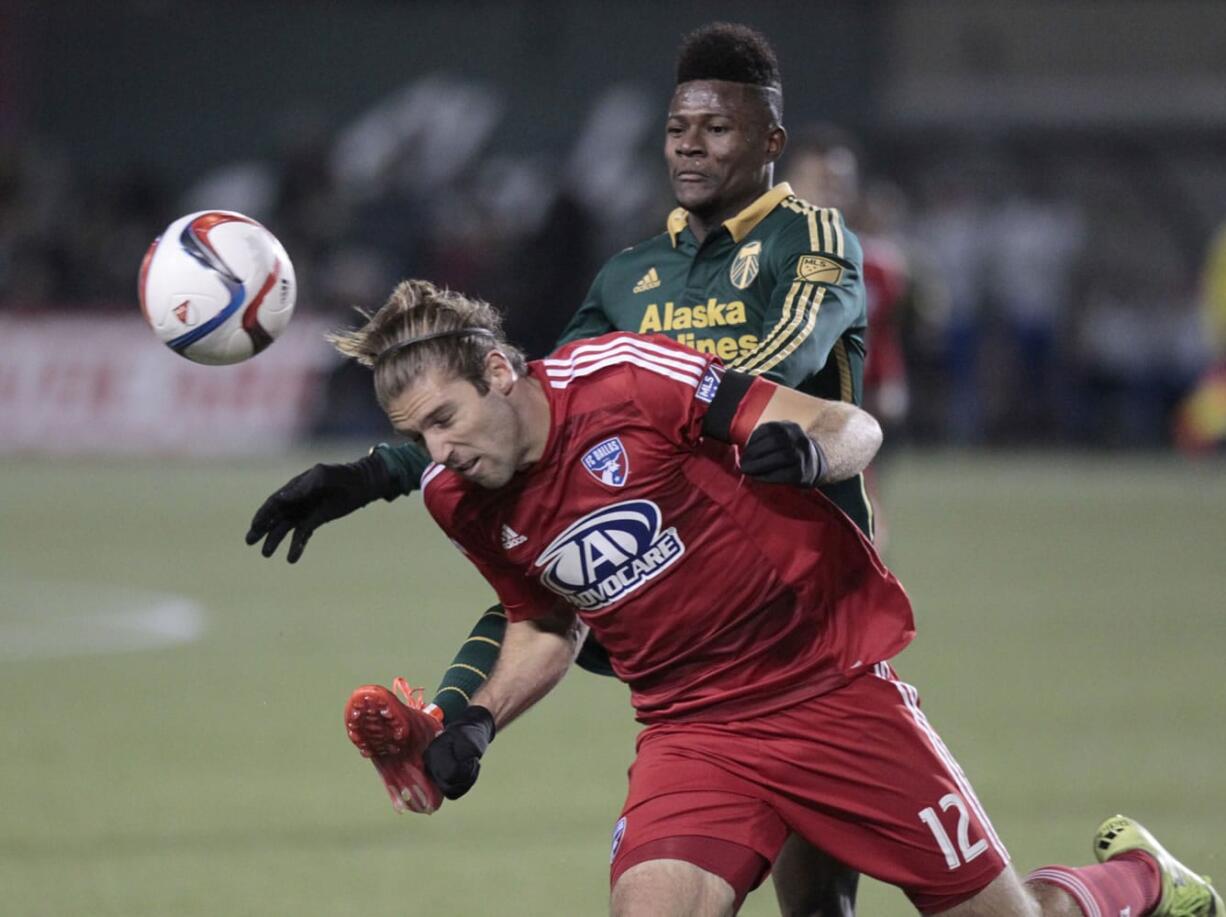 The Timbers are optimistic that Dairon Asprilla, pictured battling with Ryan Hollingshead of FC Dallas in last season's Western Conference finals, will be healthy enough to play in Sunday's season opener.