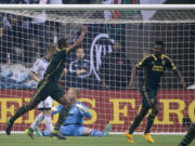 Portland Timbers FC Fanendo Adi (9) celebrates his goal past Vancouver Whitecaps goalkeeper David Ousted (1) during the first half of MLS soccer action in Vancouver, British Columbia, Canada, Sunday, Nov. 8, 2015.