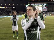 Portland Timbers midfielder Will Johnson applauds fans as he walks off the field after a second game of the Western Conference finals in the MLS Cup soccer playoffs against Real Salt Lake, Sunday, Nov. 24, 2013, in Portland, Ore. Real Salt Lake won 1-0.