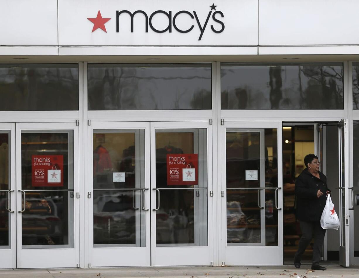 A woman walks out of Macy's department store in University Heights, Ohio.