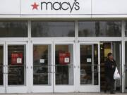 A woman walks out of Macy's department store in University Heights, Ohio.