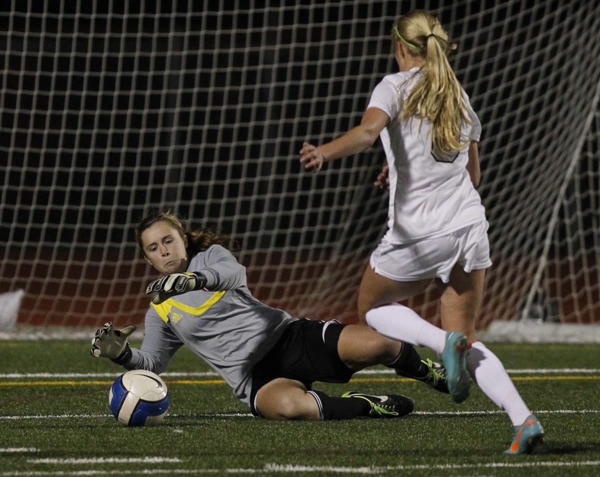 Union forward  Delaney Lindahl (R) shoots against Camas goalkeeper Marie Matthews.