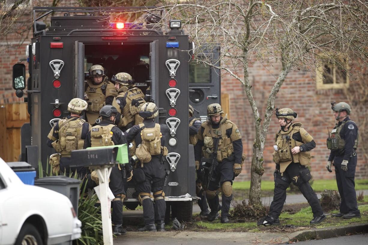 Vancouver police serve a search warrant Thursday morning at a downtown Vancouver house they believed housed a methamphetamine lab.