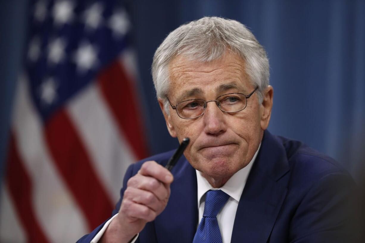 Defense Secretary Chuck Hagel takes questions as he briefs reporters at the Pentagon in Washington.