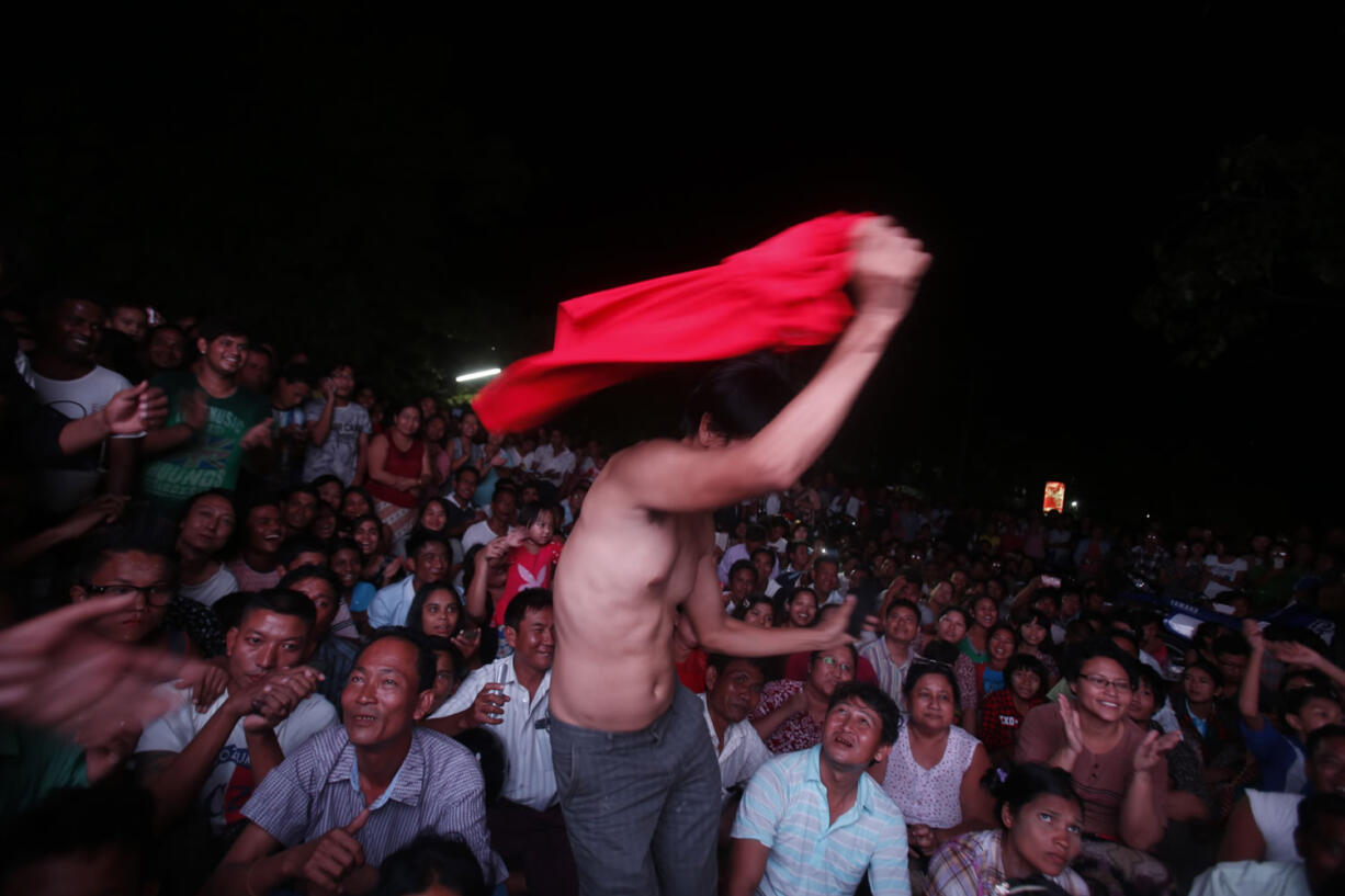 Supporters of oppositional leader Aung San Su Kyi&#039;s National League for Democracy party celebrate in Mandalay, Myanmar. Myanmar voted Sunday in historic elections that will test whether popular mandate will help loosen the military&#039;s longstanding hold on power.