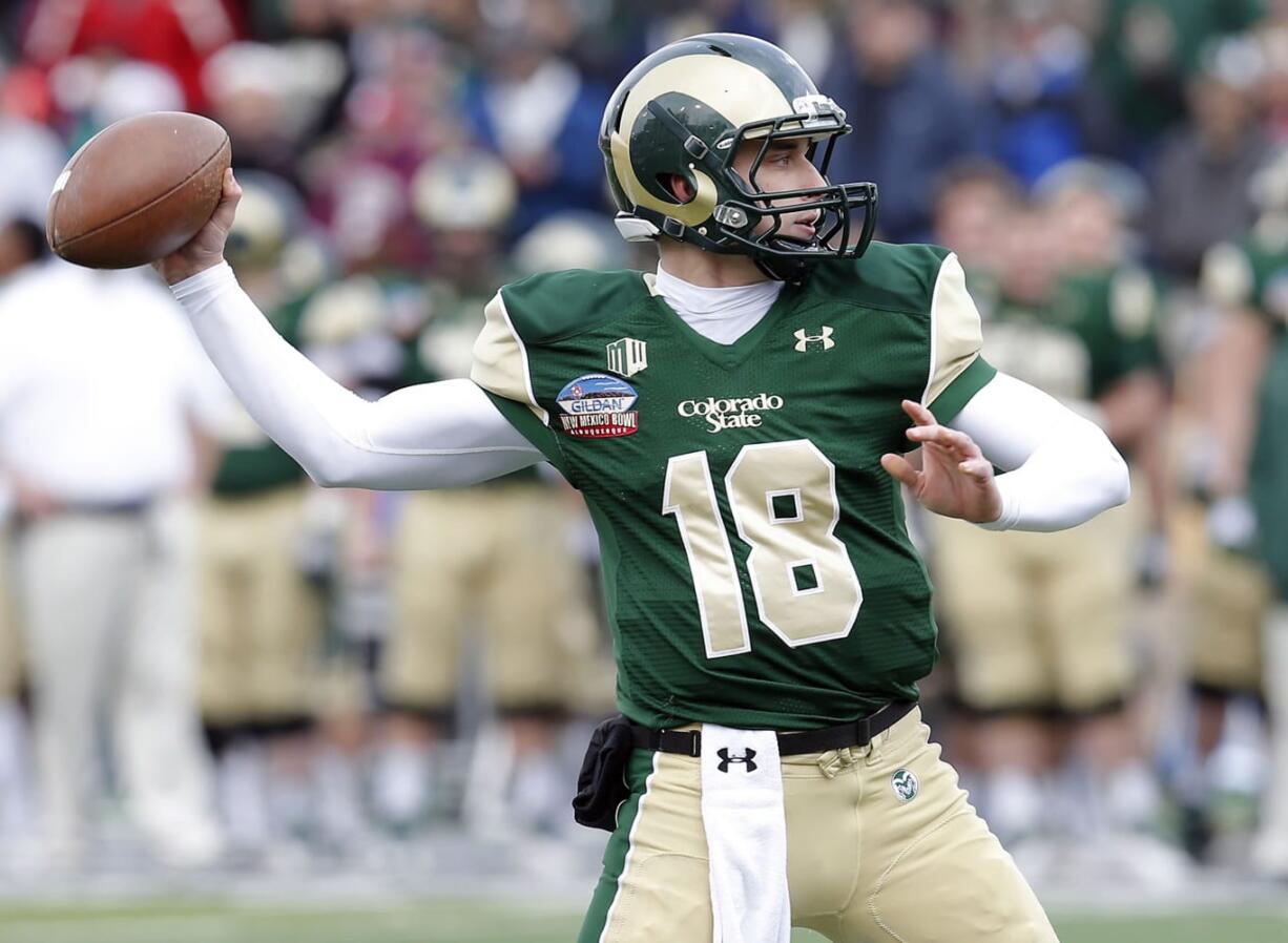 Colorado State quarterback Garrett Grayson (18) throws during the first half against Washington State, Saturday.