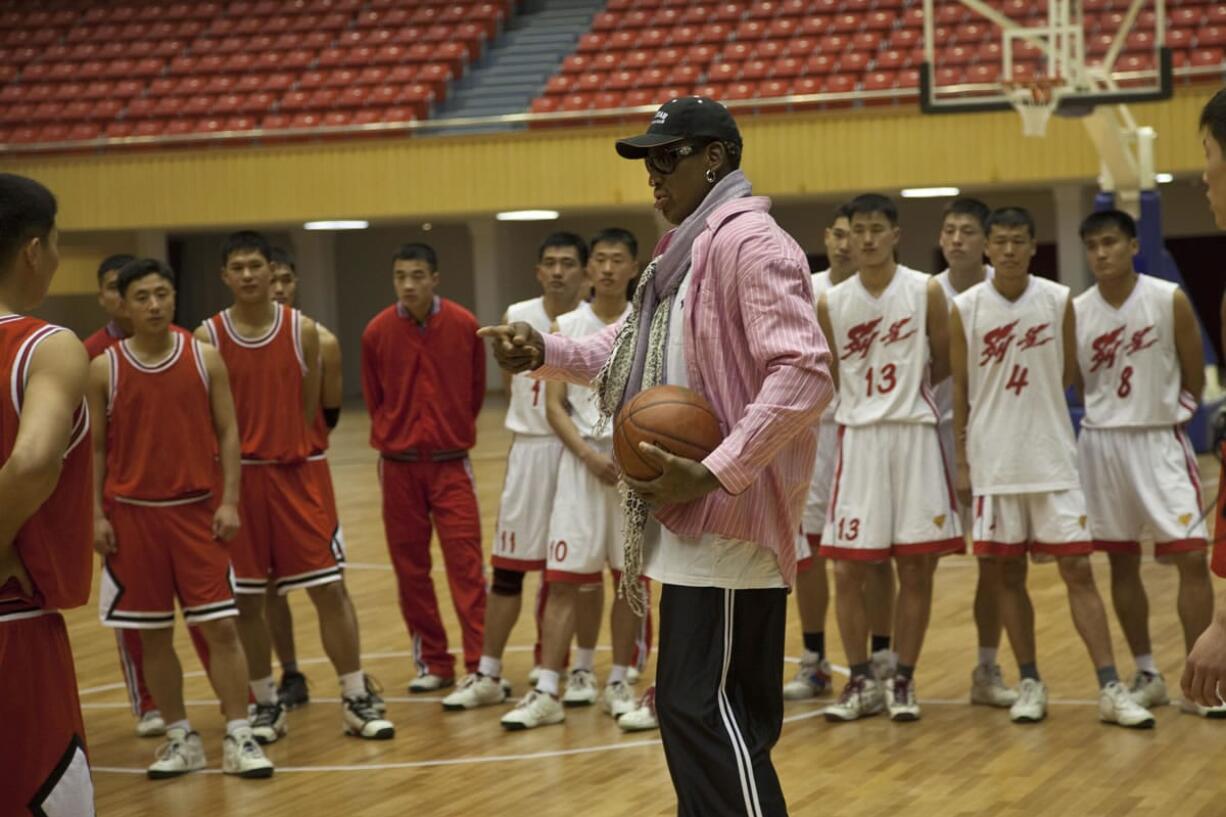 Former NBA basketball star Dennis Rodman speaks to North Korean basketball players during a practice session in Pyongyang, North Korea on Friday. During the session, Rodman selected the members of the North Korean team who will play in Pyongyang against visiting NBA stars on Jan.