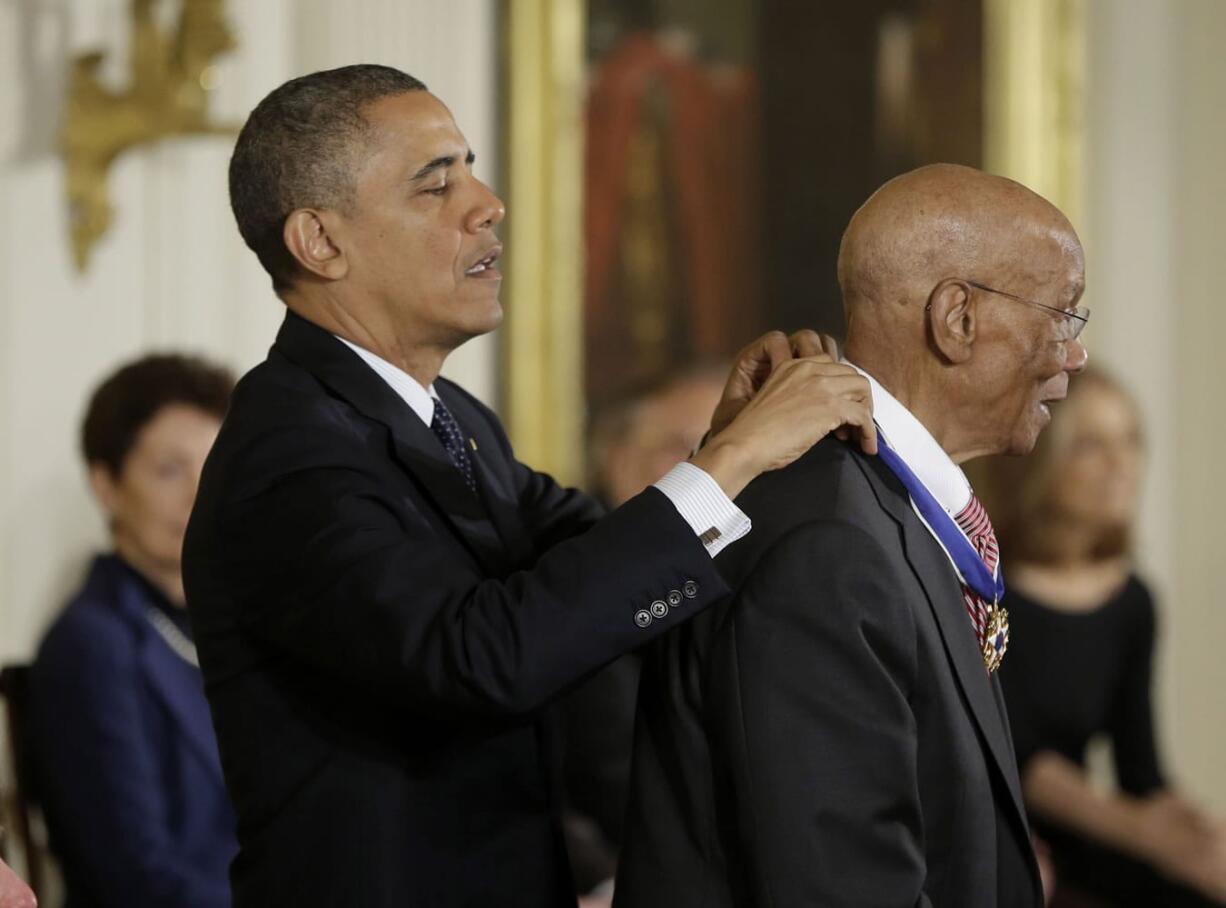 President Barack Obama awards Baseball Hall-of-Famer Ernie Banks, the Presidential Medal of Freedom on Wednesday during a ceremony in the East Room of the White House.