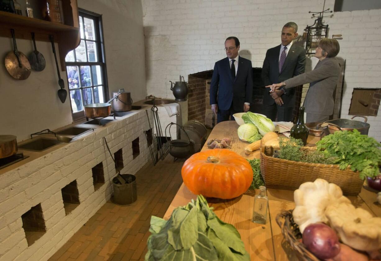 President Barack Obama and French President Francois Hollande, left, listen to Leslie Bowman, president of the Thomas Jefferson Foundation, during a tour of Monticello, President Thomas Jefferson's estate, Monday in Charlottesville, Va.