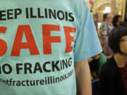 A protester attends a rally after a House Committee hearing on oil drilling, or &quot;fracking,&quot; legislation at the Illinois State Capitol in Springfield, Ill., in September.