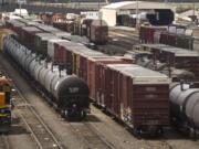 Black tank cars used to transport crude oil from North Dakota are parked among other rail traffic June 20 at a train yard in Tacoma.