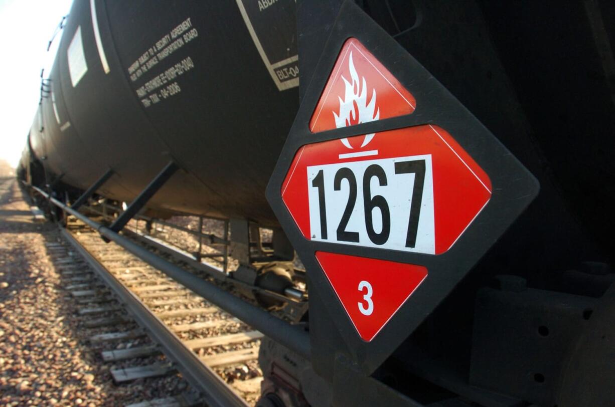 A warning placard on a tank car carrying crude oil is seen on a train idled on the tracks near a crude loading terminal in Trenton, N.D., on Nov.