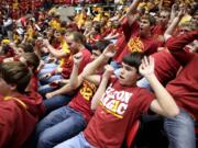 Fans in the Iowa State student section all flop as Oklahoma State's Marcus Smart is introduced Saturday.