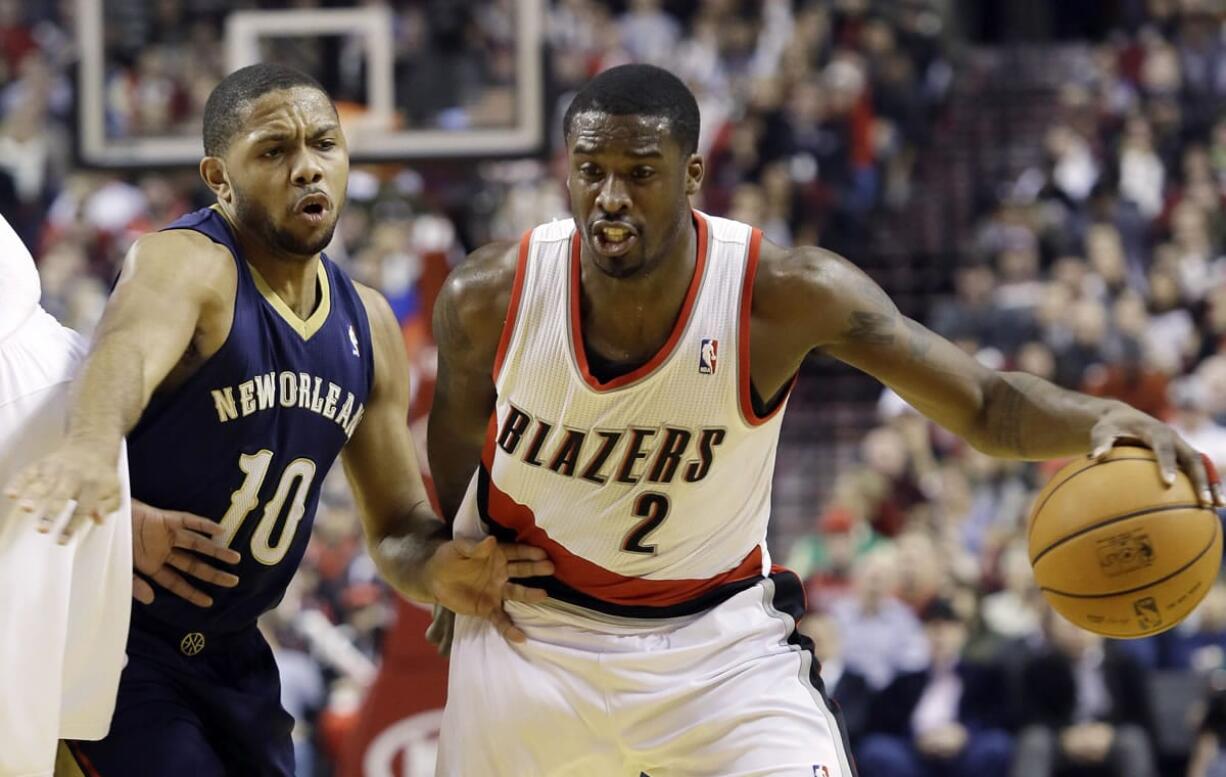 Portland Trail Blazers guard Wesley Matthews, right, drives past New Orleans Pelicans guard Eric Gordon during the first half in Portland on  Saturday.