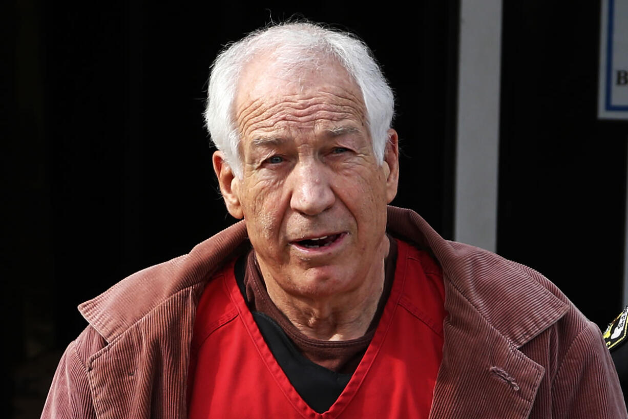 Former Penn State University assistant football coach Jerry Sandusky leaves the Centre County Courthouse on Oct. 29 after attending a hearing about his appeal in Bellefonte, Pa. The state must restore the pension of Sandusky that was taken away three years ago on the day he was sentenced to prison on child molestation convictions, a court ordered Friday. (AP Photo/Gene J.