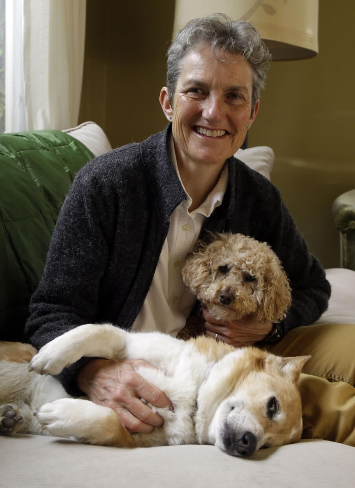 Meg McNabb, with her dogs, Ruby, front, and Missy, has been doing pet home euthanasia&#039;s for two years in Portland.