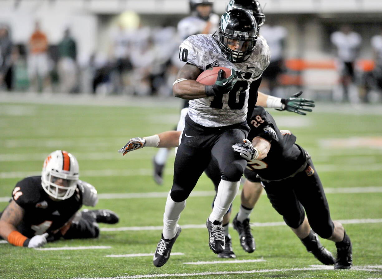 Portland State's DJ Adams (10) runs as Idaho State University's Cody Sorensen (29) makes the tackle during an NCAA college football game, Saturday, Nov. 9, 2013 in Pocatello, Idaho.