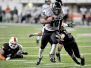 Portland State's DJ Adams (10) runs as Idaho State University's Cody Sorensen (29) makes the tackle during an NCAA college football game, Saturday, Nov. 9, 2013 in Pocatello, Idaho.