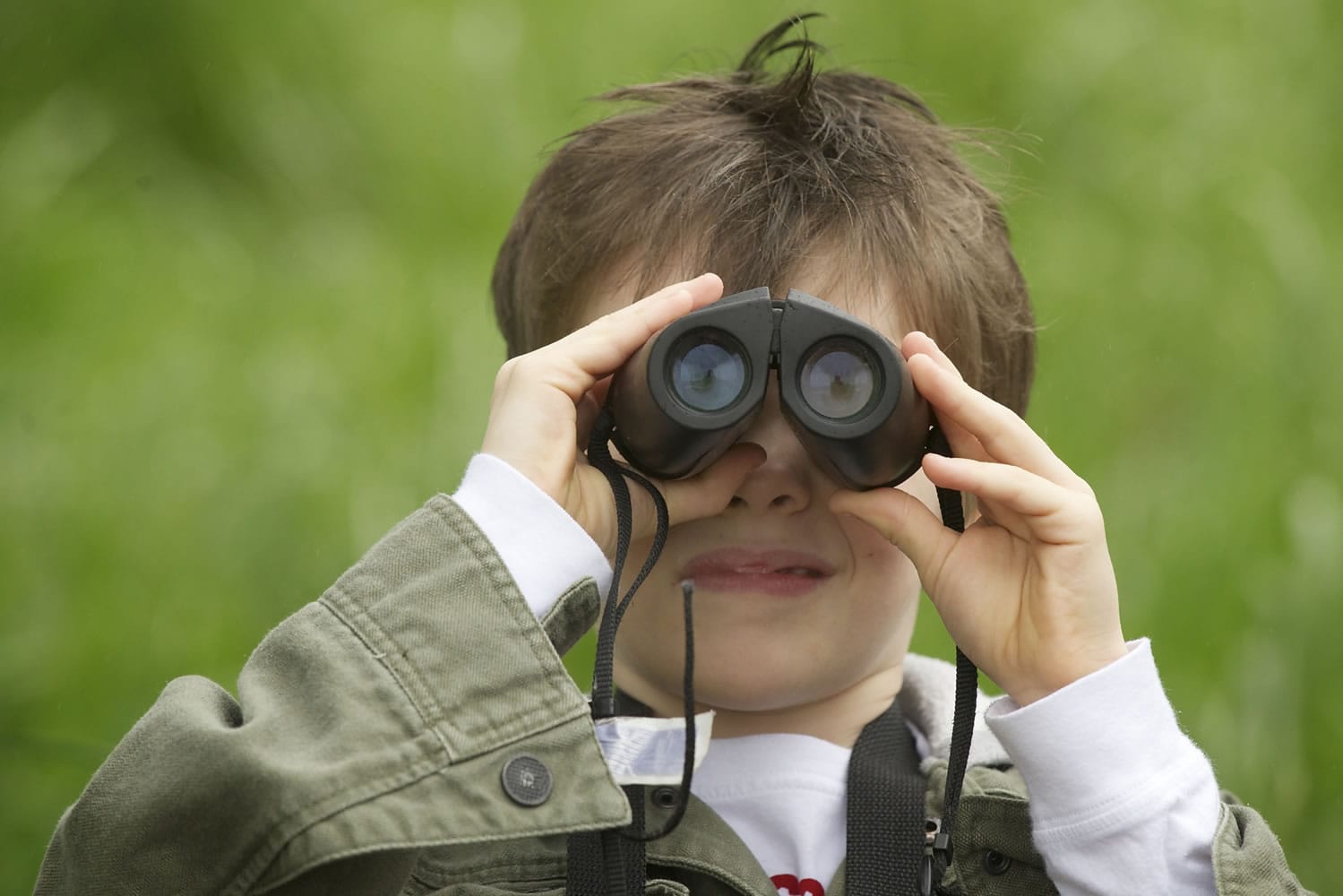 A Ridgefield National Wildlife Refuge visitor uses binoculars to get a closer look at the wildlife.