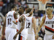 Portland Trail Blazers'  Wesley Matthews, center, celebrates a three point shot during the second half Thursday against the Houston Rockets.