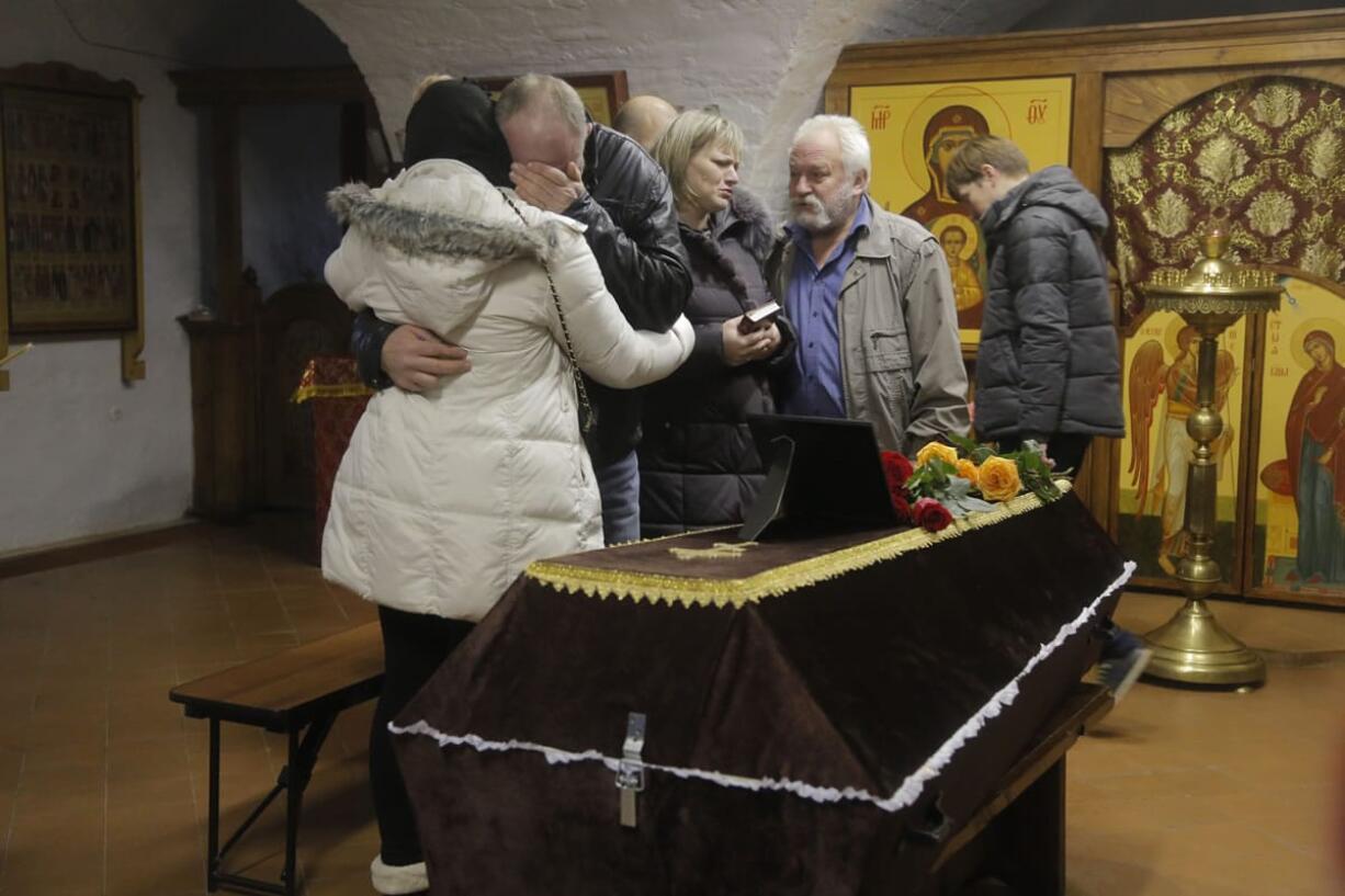 Relatives react near to the coffin of Nina Lushchenko, during a religious service at a church, in Veliky Novgorod, Russia, Thursday, Nov. 5, 2015. The first victim of Saturday&#039;s plane crash in Egypt was laid to rest on Thursday following a funeral service in a medieval church in the north Russian city of Veliky Novgorod.  Russia&#039;s Airbus 321-200 broke up over the Sinai Peninsula en route from the resort town of Sharm el-Sheikh to St. Petersburg, killing all 224 on board.