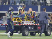 Seattle Seahawks wide receiver Ricardo Lockette (83) is carted off the field after suffering a concussion during an NFL football game against the Dallas Cowboys Sunday, Nov. 1, 2015, in Arlington, Texas.