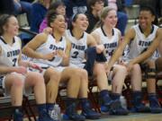 Skyview's Hannahjoy Adams, Aubrey Ward-El, Stephanie McDonagh, Kirsten Johnson and Jocelyn Adams, from left, take in the Storm's victory over Newport in a Class 4A regional game Saturday at Longview.